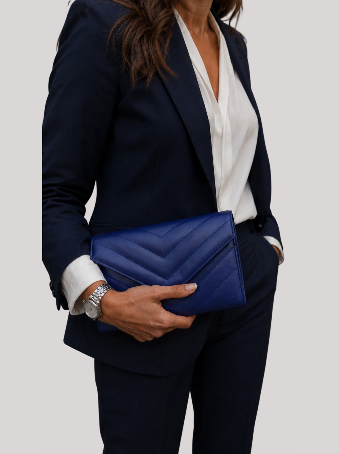 Val Blue Clutch carried as minimalist clutch — evening styling