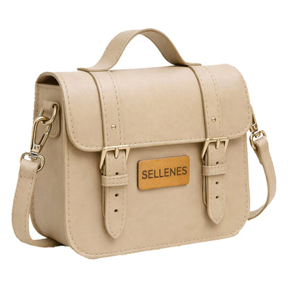 Sellenes BirkBag: A luxury cream-colored leather satchel handbag with A signature cork rectangular logo plate with 'SELLENES' is centered on the front.