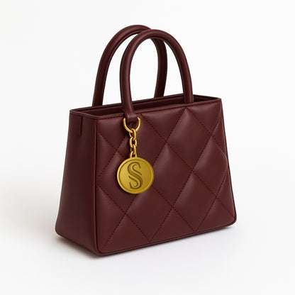 Daly bordeaux luxury leather bag with gold plated charm