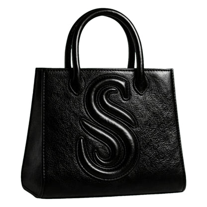 Sellenes Sally L black textured leather tote bag featuring a prominent embossed 'S' logo , handcrafted in Europe in limited series