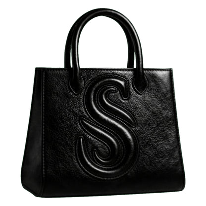 Sellenes Sally L black textured leather tote bag featuring a prominent embossed 'S' logo and structured top handles