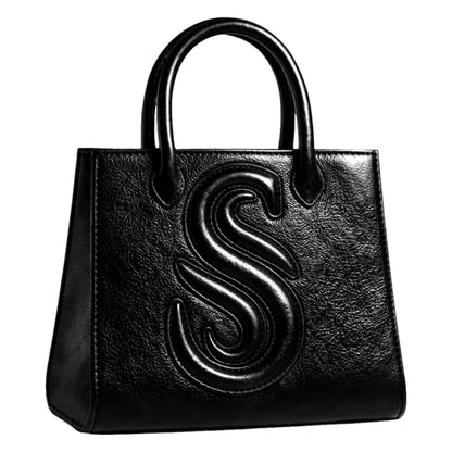 Sellenes Sally L black textured leather tote bag featuring a prominent embossed 'S' logo , handcrafted in Europe in limited series