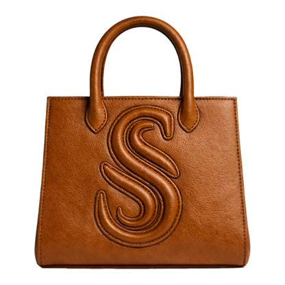 Sellenes Sally L cognac brown leather top-handle bag showcasing a raised 'S' monogram and premium stitching details.
